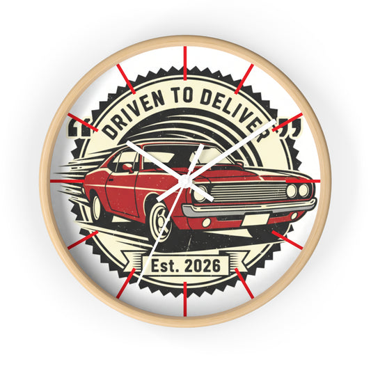Wall clock with a red car design and text 'Driven to Deliver Est. 2026' on a white background