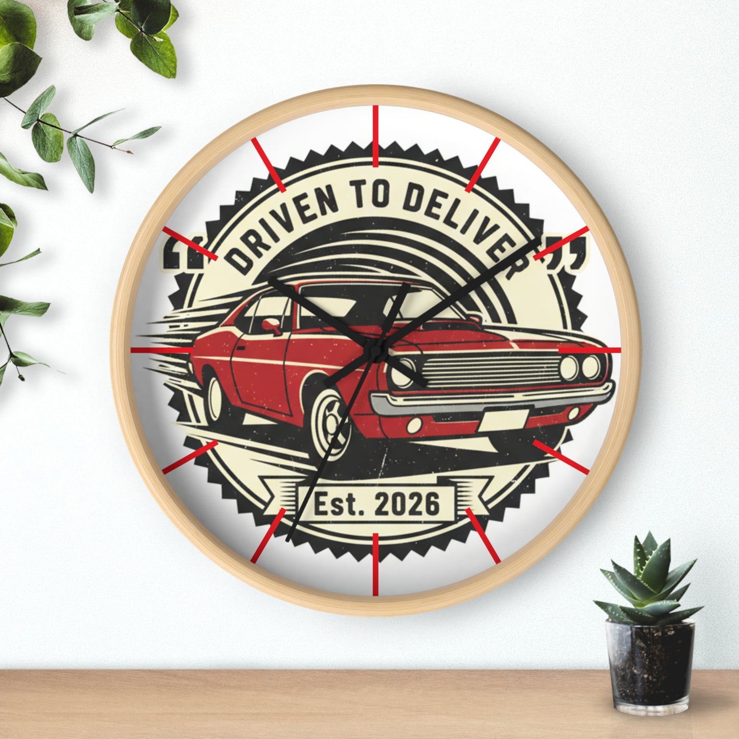 Wall clock with a red car design and text 'Driven to Deliver' on a white background.