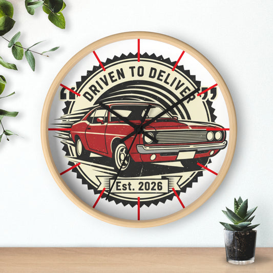 Wall clock with a red car design and text 'Driven to Deliver' on a white background.